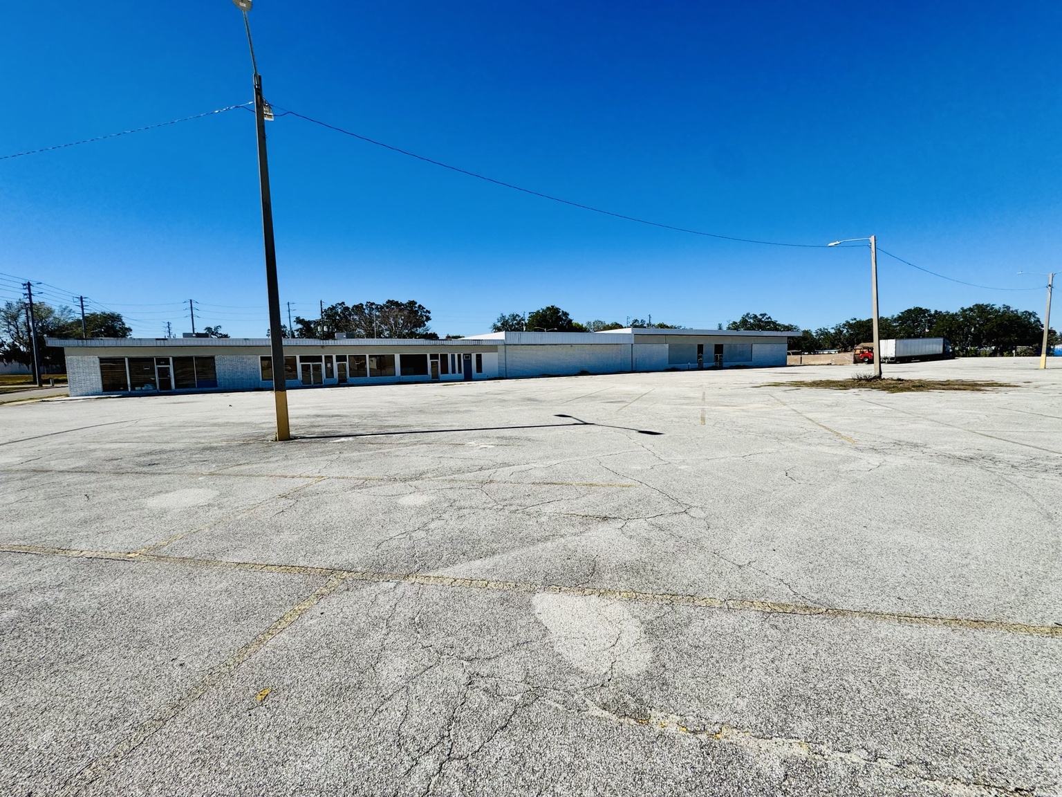 Front exterior and parking area at Liberty Plaza